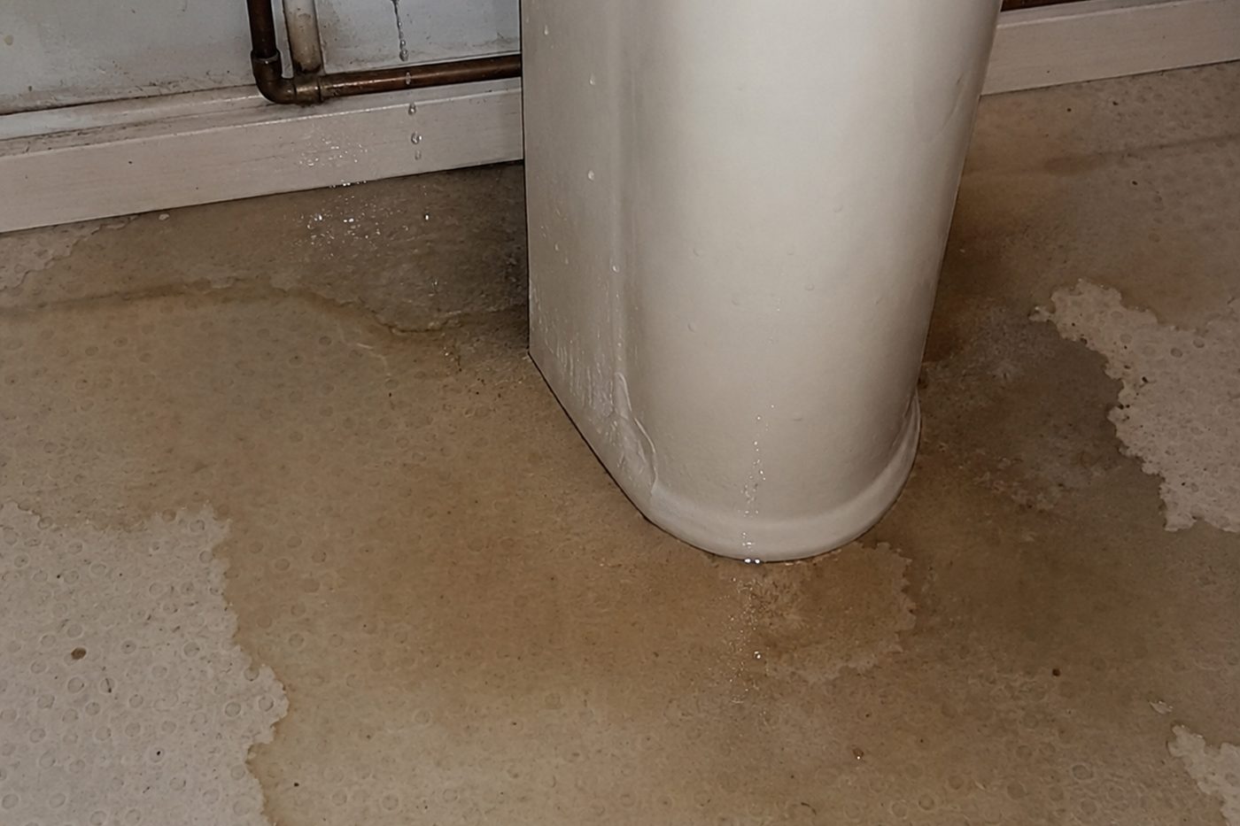Bathroom floor after a toilet overflow in a Plymouth home